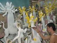 Artist Nondi Paul paints a sculpture of Goddess Durga Idols as part of preparation for the upcoming Hindu religious Durga Puja festival. On...
