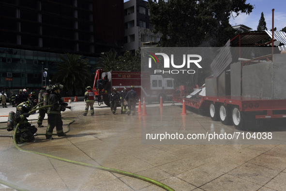   Firefighters extinguish fire to demonstrate to people the precautions to take during a 7.1 earthquake  during   the Earthquake Mega Drill...