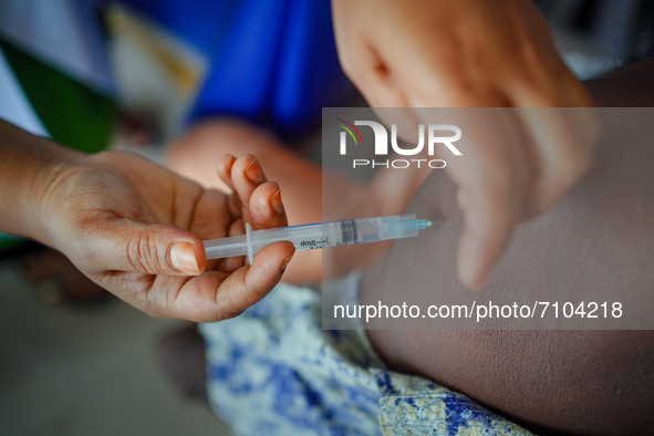  A person receives the first dose of Sinopharm vaccine during a national health campaign  against COVID-19, to reduce infections by the coro...
