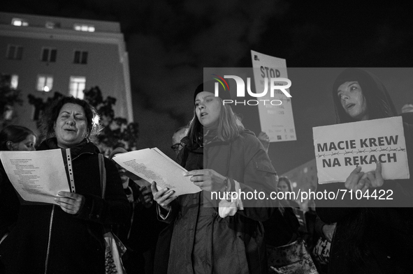 (EDITOR'S NOTE: Image was converted to black and white) Group of activists and citizens gathered in front of Polish Border Guard's HQ in War...