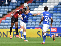  Oldham Athletic's Carl Piergianni tussles with Mike Fondop of Hartlepool United during the Sky Bet League 2 match between Oldham Athletic a...