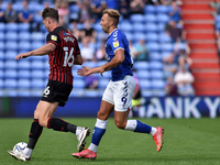  Oldham Athletic's Hallam Hope tussles with Neill Byrne of Hartlepool United during the Sky Bet League 2 match between Oldham Athletic and H...