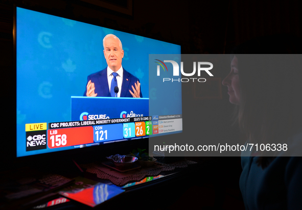 A woman watches Conservative Party of Canada leader Erin O'Toole speaking during a televised address on election night on CBC News.
Early el...