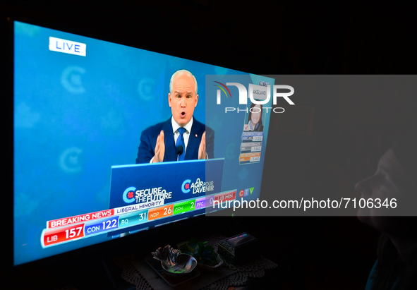A woman watches Conservative Party of Canada leader Erin O'Toole speaking during a televised address on election night on CTV News.
Early el...