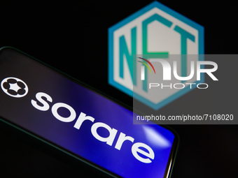 Sorare logo displayed on a phone screen and NFT logo displayed on a laptop screen are seen in this illustration photo taken in Krakow, Polan...