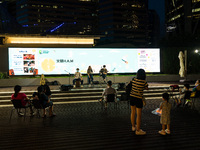 Hong Kong, China, 21 Sep 2021,  People listen to a live band in the zero carbon park of Kowloon Bay on the occasion of mid-autumn festival....