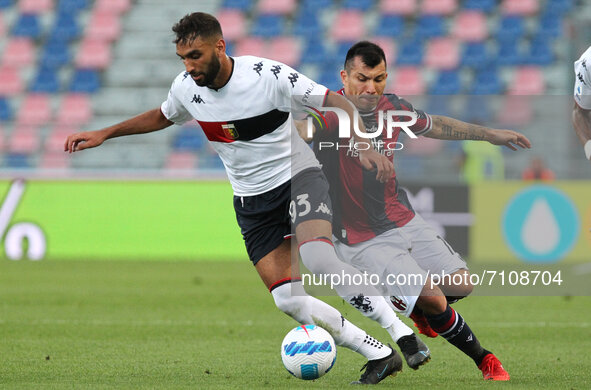 Mohamed Fares (Genoa CFC) competes for the ball with Gary Medel (Bologna F.C.) during the Italian Serie A soccer match Bologna F.C. vs Genoa...