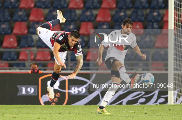 Kevin Bonifazi (Bologna F.C.) (left) competes for the ball with Mattia Destro (Genoa CFC)  during the Italian Serie A soccer match Bologna F...