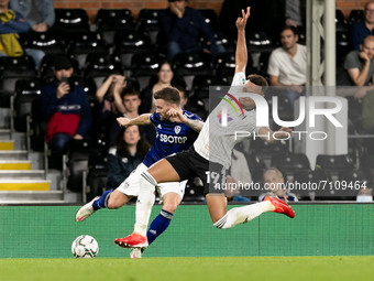 Stuart Dallas of Leeds United and Rodrigo Muniz of Fulham compete for the ball during the Carabao Cup match between Fulham and Leeds United...