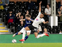 Stuart Dallas of Leeds United and Rodrigo Muniz of Fulham compete for the ball during the Carabao Cup match between Fulham and Leeds United...