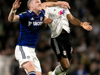 Adam Forshaw of Leeds United and Bobby Reid of Fulham battle for the ball in the air during the Carabao Cup match between Fulham and Leeds U...