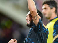 Hakan Calhanoglu of FC Internazionale celebrates the victory at the end of the Serie A match between ACF Fiorentina and FC Internazionale at...