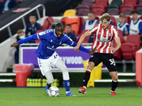  Oldham Athletic's Dylan Bahamboula and Mads Roerslev of Brentford during the Carabao Cup match between Brentford and Oldham Athletic at the...