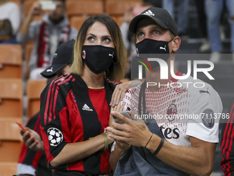 Fans of AC Milan attend during the Serie A match between AC Milan and Venezia FC at Stadio Giuseppe Meazza on September 22, 2021 in Milan, I...