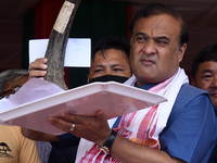 Assam Chief Minister Himanta Bishwa Sarma showing a large rhino horn at a ceremony which to be stored for research and educational purpose....