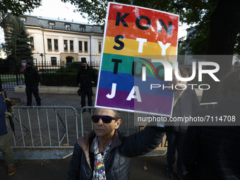 A protester holds a sign in front of the Constitutional Tribunal in Warsaw, Poland on September 22, 2021. On Wednesday the Tribunal was set...