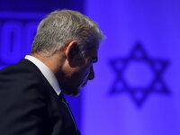 Israeli Foreign minister and Yesh Atid party chairman Yair Lapid speaks at a Yesh Atid party conference marking 100 days for the formation o...