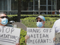 Behind the protestors people could be seen lining up at the U.S. passport office in the Leland Federal Building on Wednesday, September 22nd...