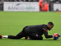 Mike Maignan of AC Milan warms up during the Serie A 2021/22 football match between AC Milan and Venezia FC at Giuseppe Meazza Stadium, Mila...