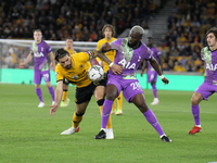 Tanguy NDombèlé of Tottenham Hotspur challenges Rubén Neves of Wolverhampton Wanderers during the Carabao Cup match between Wolverhampton Wa...