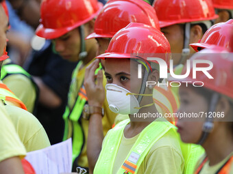 Libis, Quezon City Philippines - Rescue workers are briefed before the nationwide earthquake drill in Libis, Quezon City on Thursday, July 3...