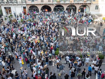 People take part in the demonstration 'Fridays for Future' to denounce the environmental devastation in Piazza Arnaldo in Brescia, Italy, on...