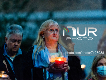 Women hold lighted candles during a vigil for 28 year-old teacher Sabina Nessa, in London, Britain, 24 September 2021. Sabina Nessa, a 28-ye...