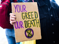 Banner 'Your Greed Our Death' is seen during Climate Strike protest organized by Fridays for Future movement also known as Youth Strike for...