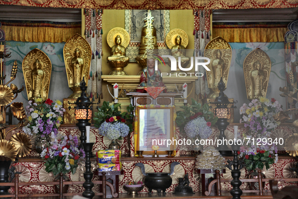 Sacred items and statues adorn the shrine in the Nipponzan Myohoji Buddhist Temple in Darjeeling, West Bengal, India. 