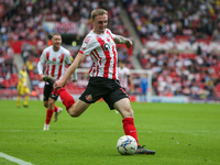 Sunderland's Carl Winchester crosses a ball into the box during the Sky Bet League 1 match between Sunderland and Bolton Wanderers at the St...