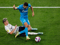 Aleksei Sutormin (R) of Zenit and Anton Zinkovskiy of Krylia Sovetov vie for the ball during the Russian Premier League match between FC Zen...