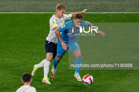 Danil Krugovoy (R) of Zenit and Sergey Piniaev of Krylia Sovetov vie for the ball during the Russian Premier League match between FC Zenit S...