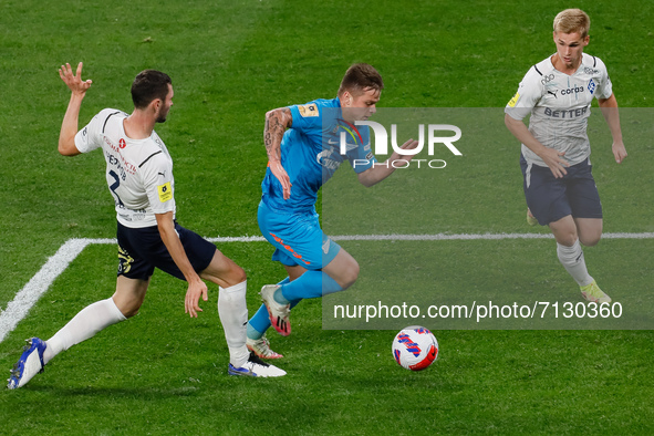 Danil Krugovoy (C) of Zenit vies for the ball with Nikita Chernov (L) and Sergey Piniaev of Krylia Sovetov during the Russian Premier League...