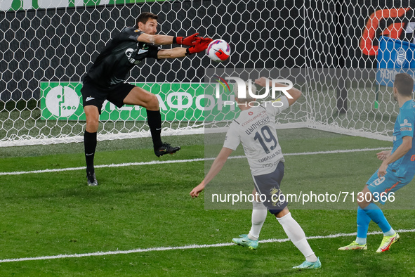 Stanislav Kritciuk (L) of Zenit saves the ball after Dmitriy Tsypchenko (C) of Krylia Sovetov last minute header during the Russian Premier...