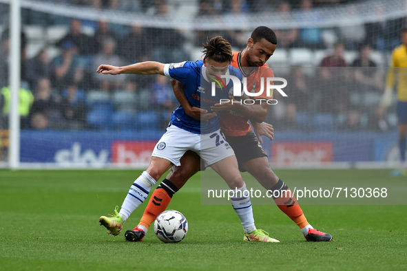 Oldham Athletic's Jordan Clarke tussles with Danny Cashman of Rochdale AFC during the Sky Bet League 2 match between Rochdale and Oldham Ath...