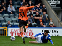 Oldham Athletic's Benny Couto tussles with Corey O'Keeffe of Rochdale AFC during the Sky Bet League 2 match between Rochdale and Oldham Athl...