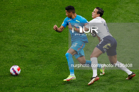 Douglas Santos (L) of Zenit and Mehdi Zeffane of Krylia Sovetov vie for the ball during the Russian Premier League match between FC Zenit Sa...