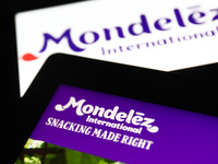Mondelez International logos displayed on a laptop and a phone screens are seen in this illustration photo taken in Krakow, Poland on Septem...