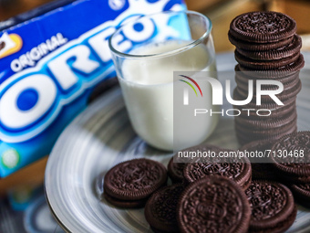 Oreo cookies on a plate, a glass of milk and Oreo packaging are seen in this illustration photo taken in Krakow, Poland on September 25, 202...
