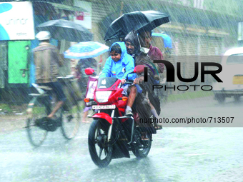 heavy rain from Cyclone Komen in Kolkata on July 31, 2015. The cyclone made landfall in Bangladesh as it dropped heavy rain across the Bay o...