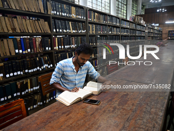 Students reads book in the central library of Dhaka University after reopen in Dhaka, Bangladesh, on September 26, 2021, as Dhaka University...