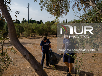 Volunteers of the Terrae Association clean up the green lung of the city Lama Martina during the National Plastic Free Day in Molfetta on Se...
