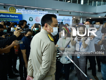 Thailand's Deputy Prime Minister and the Minister of Public Health, Anutin Charnvirakul, wearing a face mask speaks to the media at a vaccin...