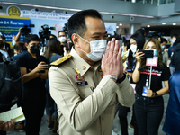 Thailand's Deputy Prime Minister and the Minister of Public Health, Anutin Charnvirakul, wearing a face mask arrives at a vaccination centre...