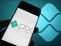 In this photo illustration a Pix logo seen displayed on a smartphone with a Pix logo in the background. The Central Bank announced measures...