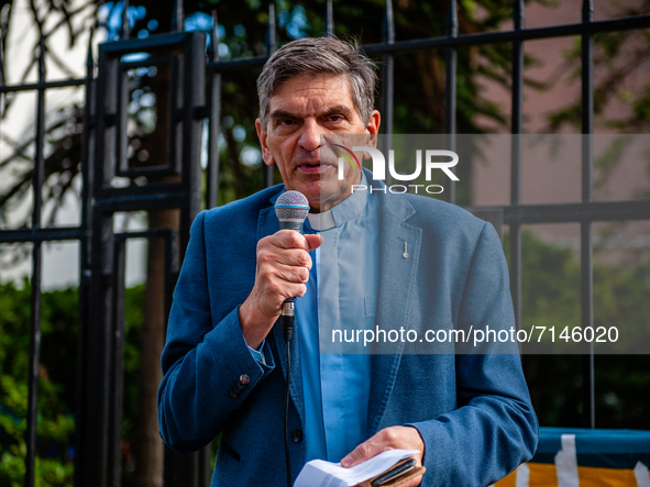 A pastor is giving a speech in support of the refugees, during a demonstration in support of the refugees stuck in the frontier between Bela...
