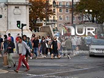 People walk through the Chiado district in Lisbon, Portugal on September 27, 2021. Portugal recorded one death and 230 new cases of SARS-CoV...