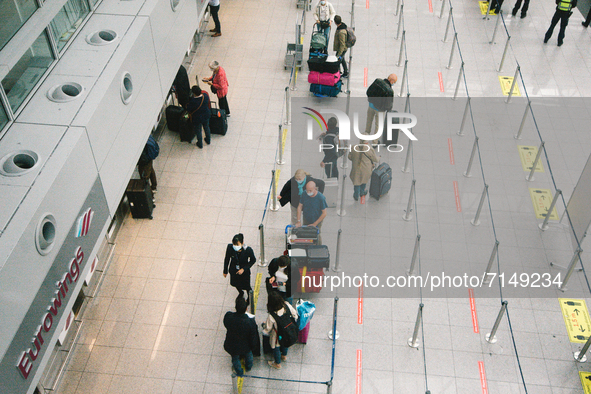 people wait to get check in in front of Eurowings check in area at Duessldorf airport, Germany on September 29, 2021 