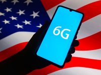6G sign is seen on the smartphone screen with U.S. national flag in the background in this  illustration photo taken in Krakow, Poland on Se...