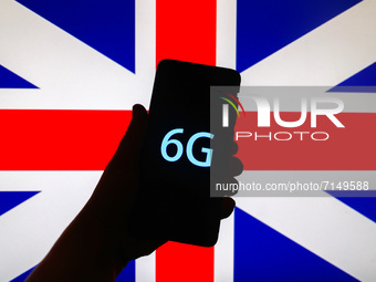 6G sign is seen on the smartphone screen with the national flag of the United Kingdom in the background in this  illustration photo taken in...